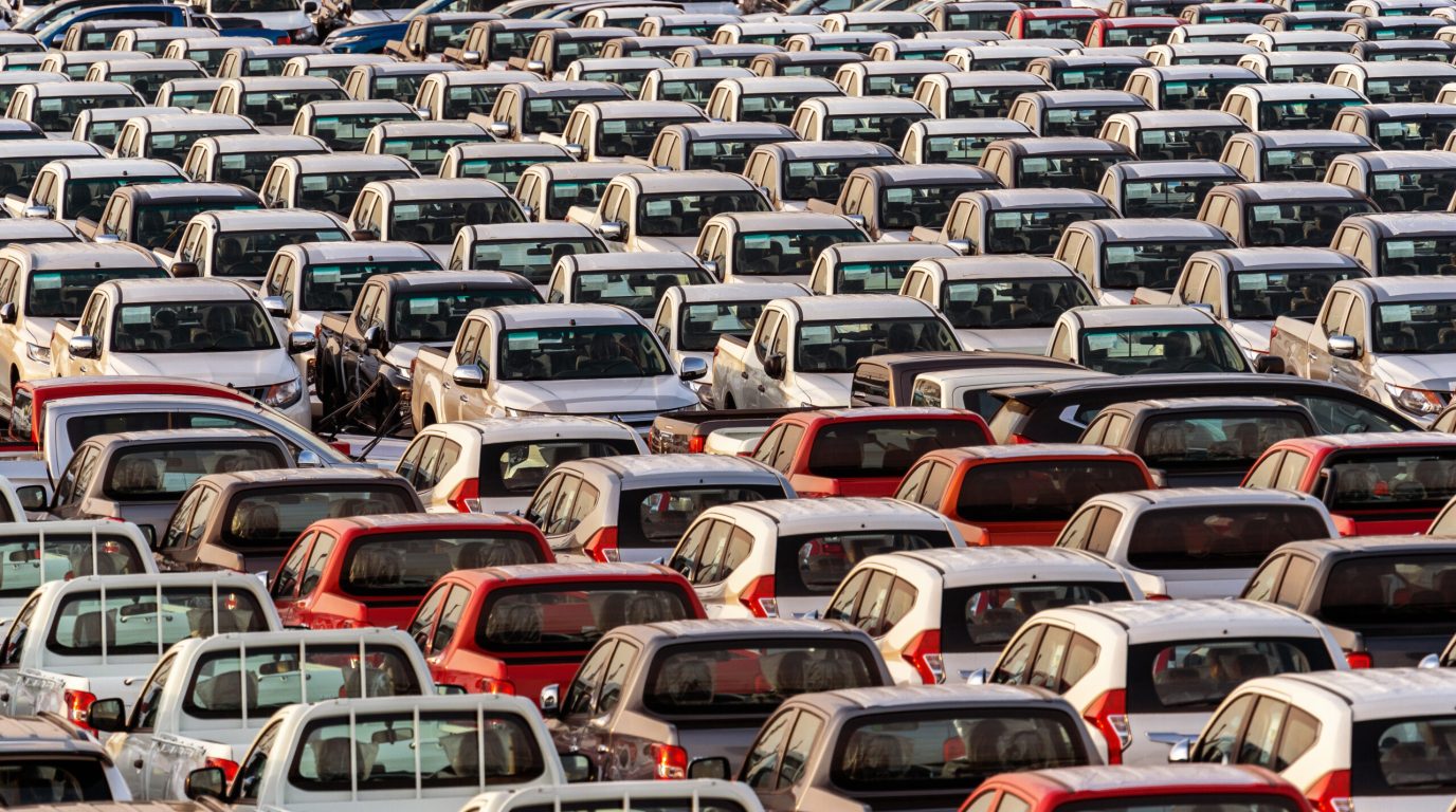 Row of new cars in port. Row of new cars in port.